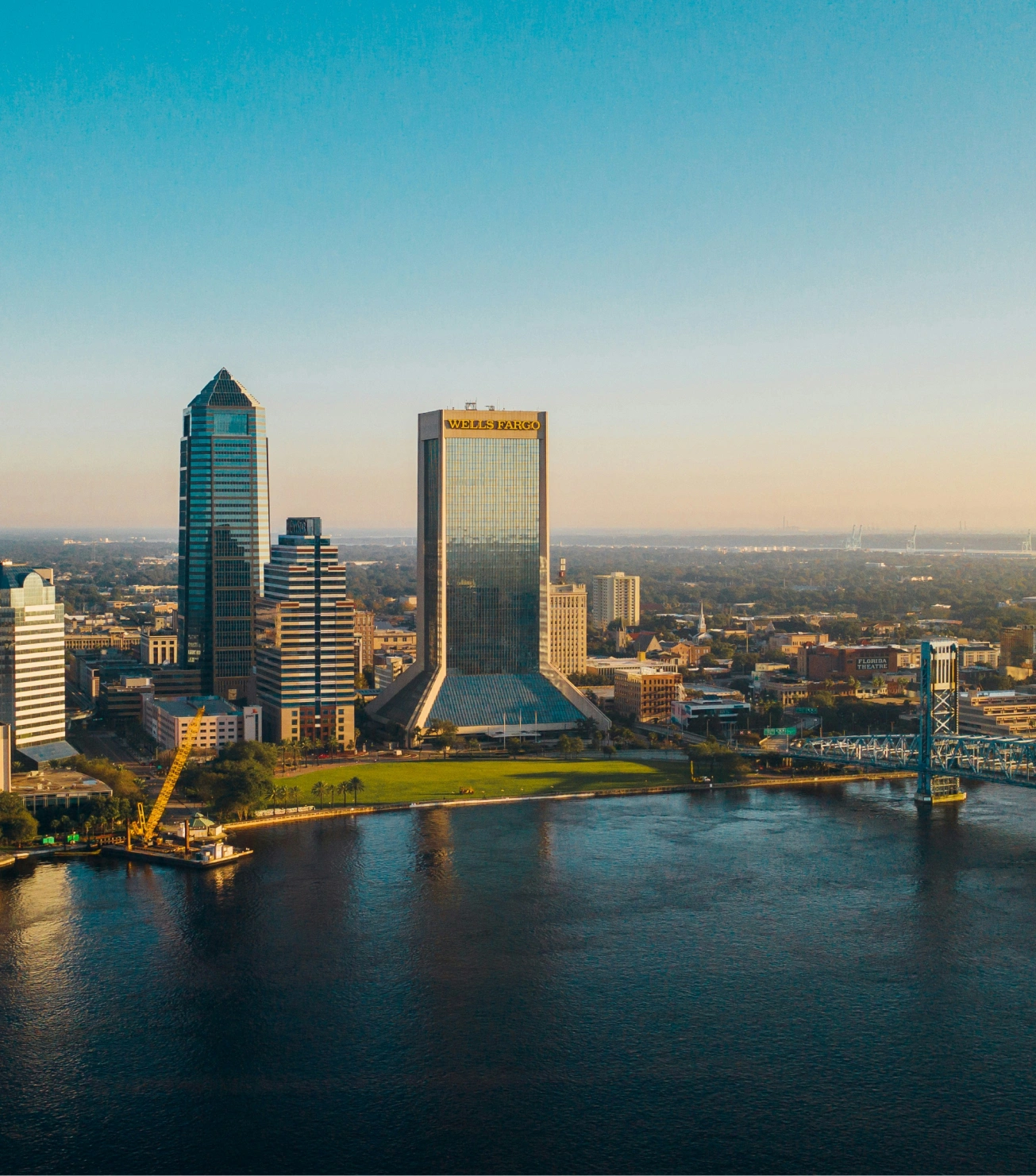 Expansive private terrace of a Four Seasons Jacksonville luxury condo with panoramic skyline views of Downtown Jacksonville.